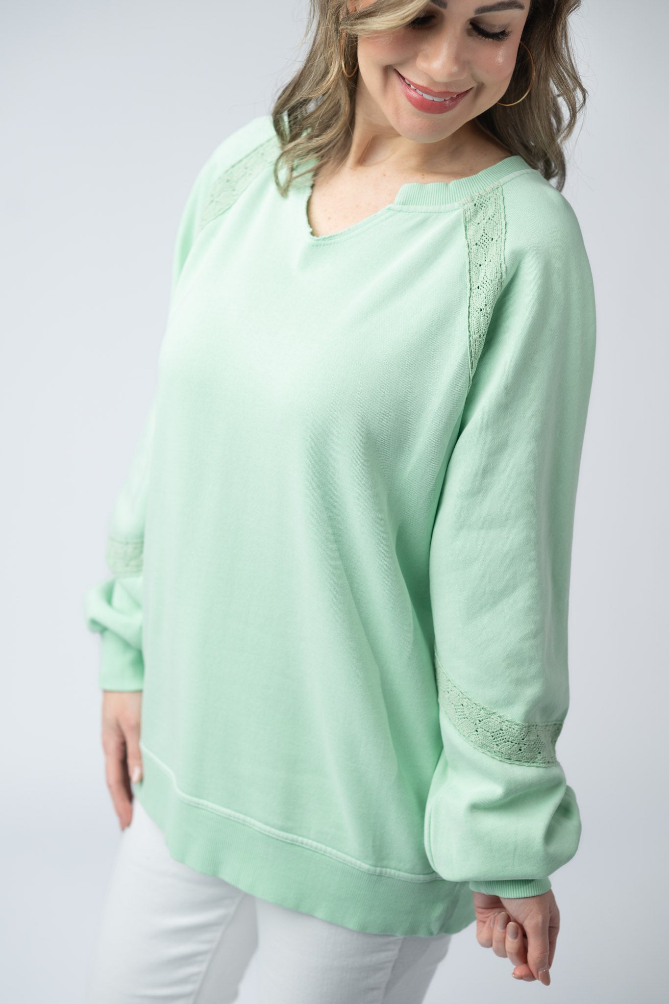 Women's lace accent vintage wash pullover in Mint with notch neckline, lace shoulder and sleeve details, and relaxed fit