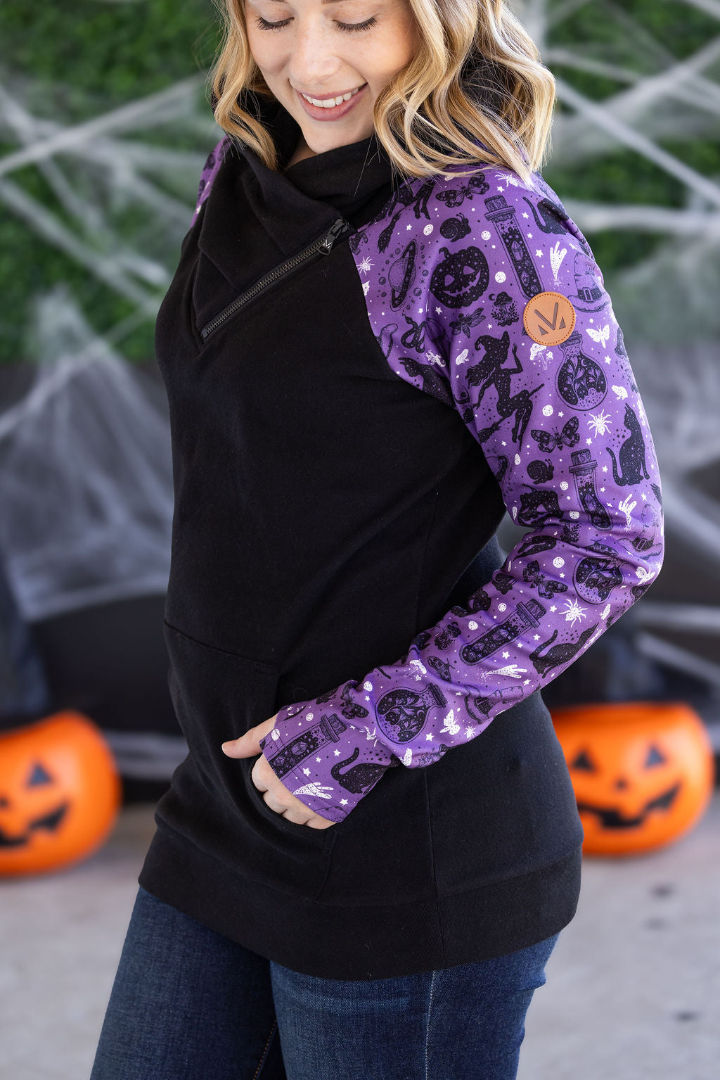 Zoey ZipCowl Sweatshirt in I Put a Spell On You with black body and purple printed sleeves