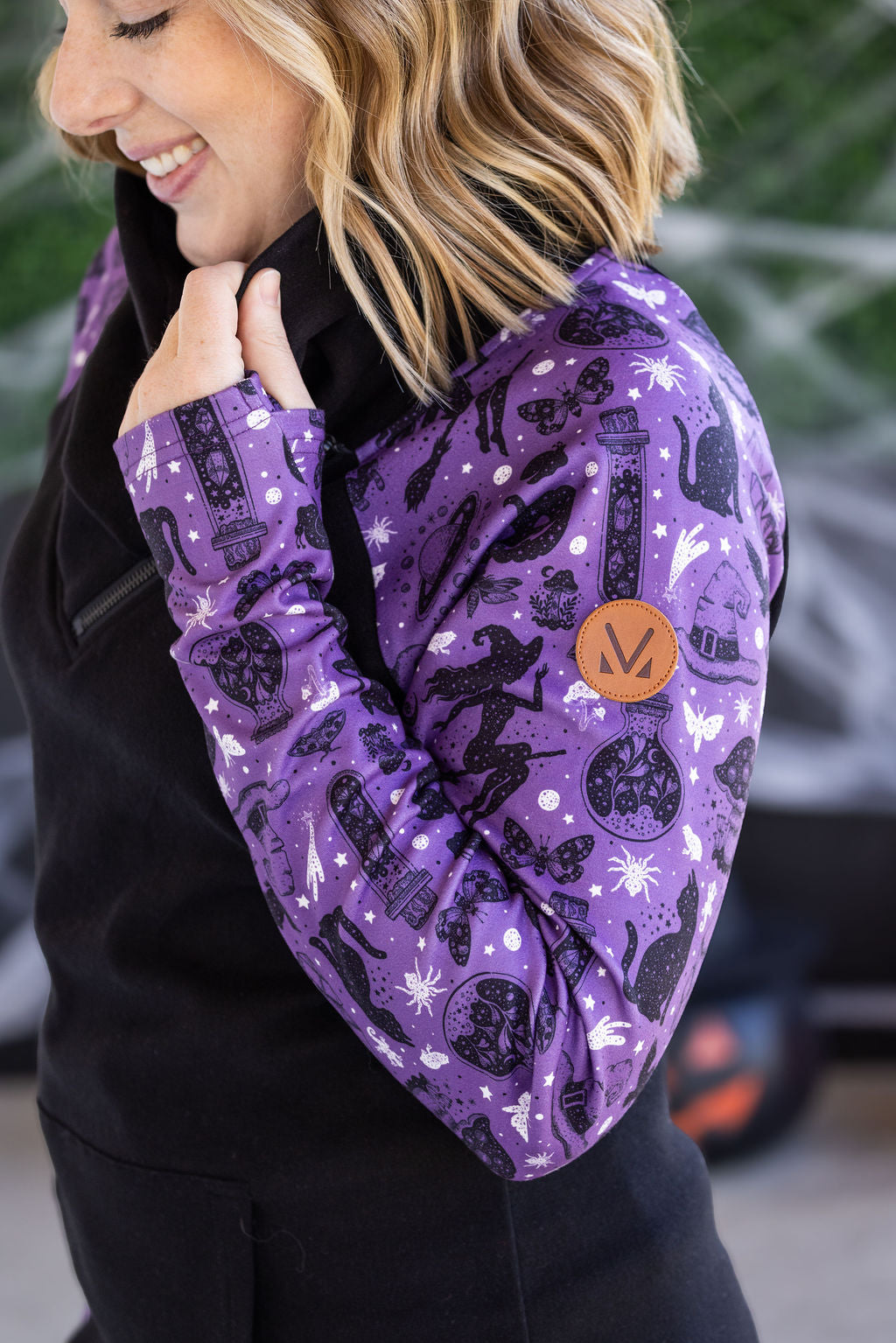 Zoey ZipCowl Sweatshirt in I Put a Spell On You with black body and purple printed sleeves