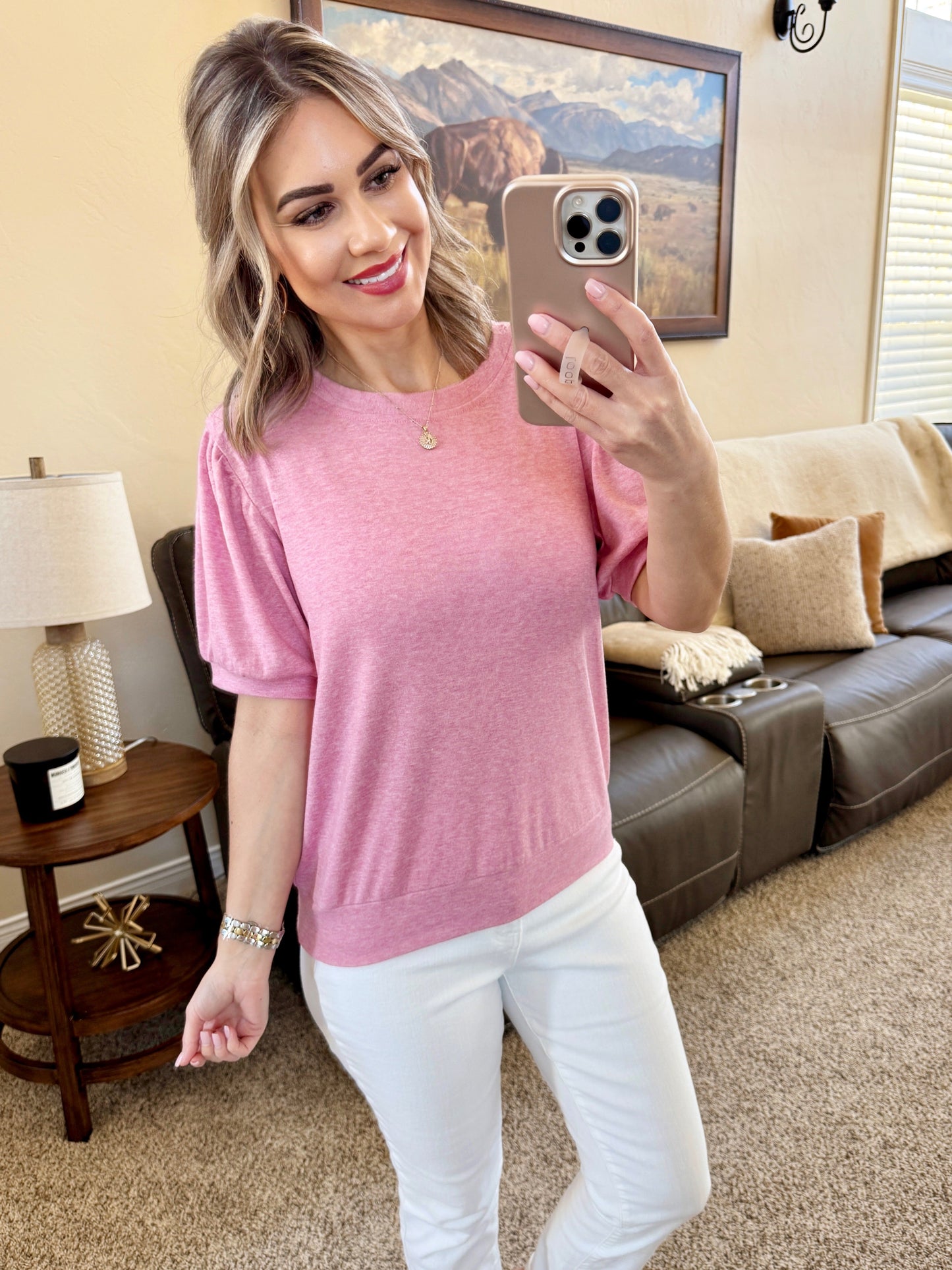 Woman wearing heathered pink Katie Cozy Top by Michelle Mae featuring feminine gathered sleeves and rounded neckline