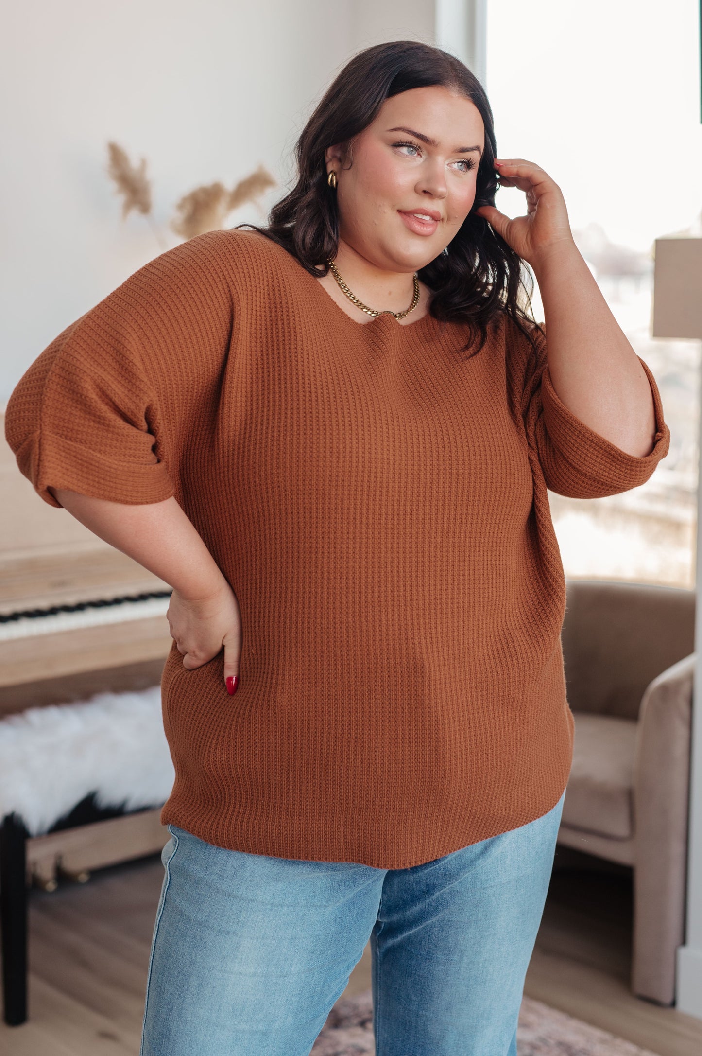Rust knit sweater with boat neckline and dolman sleeves