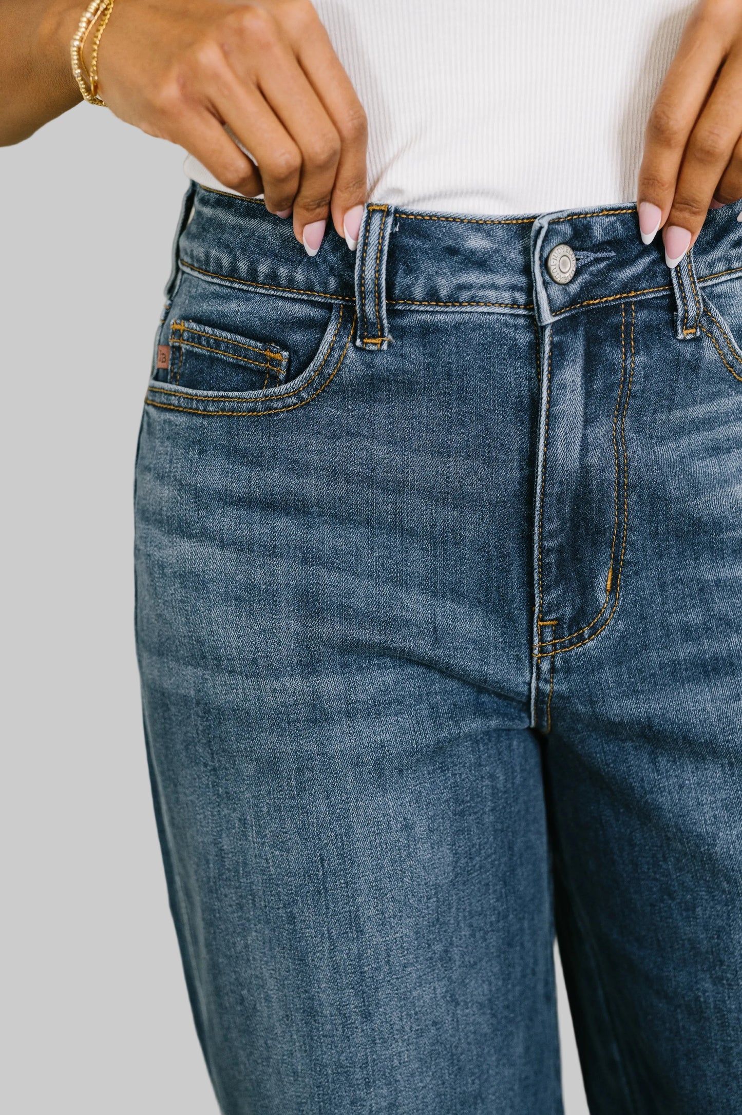 Marie High Waist Wilhelmina Baggy Jeans by Judy Blue in medium wash featuring high rise button fly and wide leg silhouette paired with white top