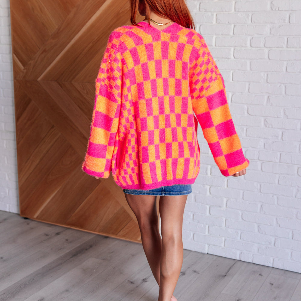 
                      
                        Noticed in Neon Checkered Cardigan in Pink and Orange
                      
                    