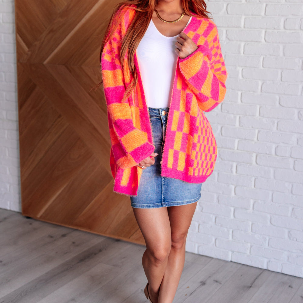 
                      
                        Noticed in Neon Checkered Cardigan in Pink and Orange
                      
                    