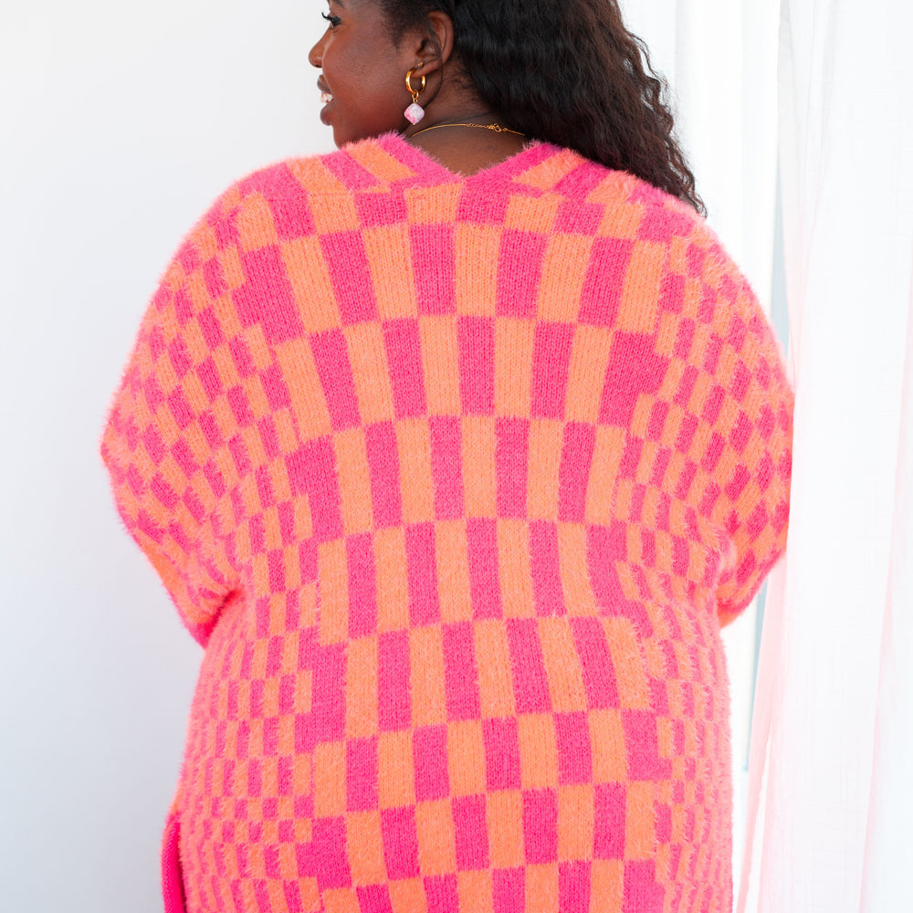 
                      
                        Noticed in Neon Checkered Cardigan in Pink and Orange
                      
                    