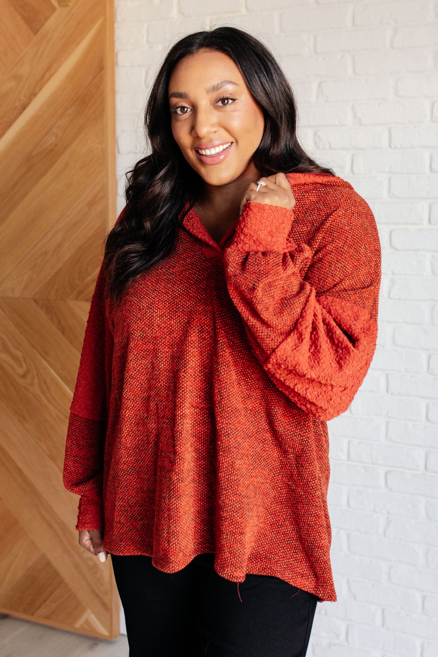 Patchwork Textured Hoodie in Rust with hooded V-neckline and contrast knit detail
