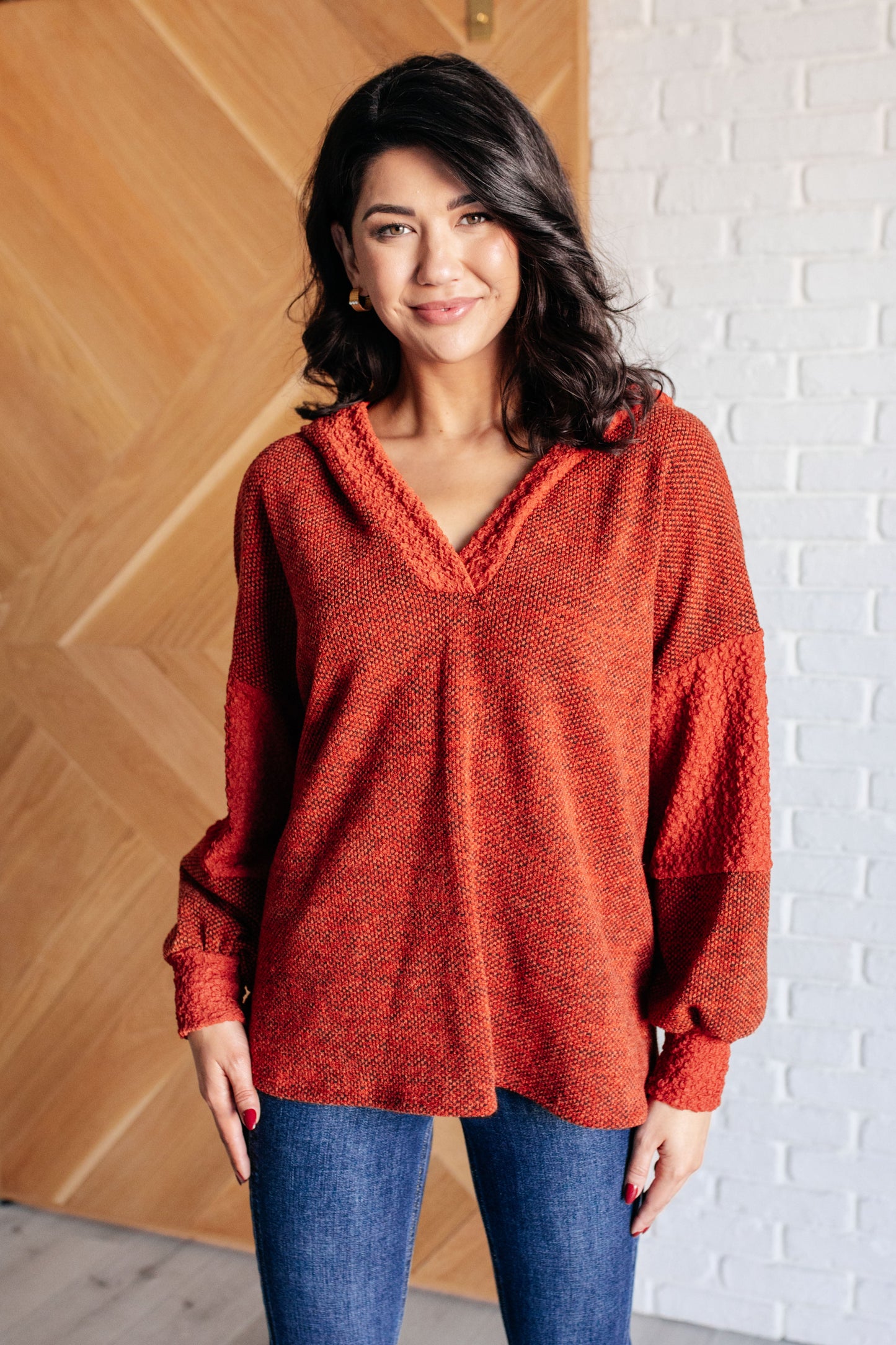 Patchwork Textured Hoodie in Rust with hooded V-neckline and contrast knit detail