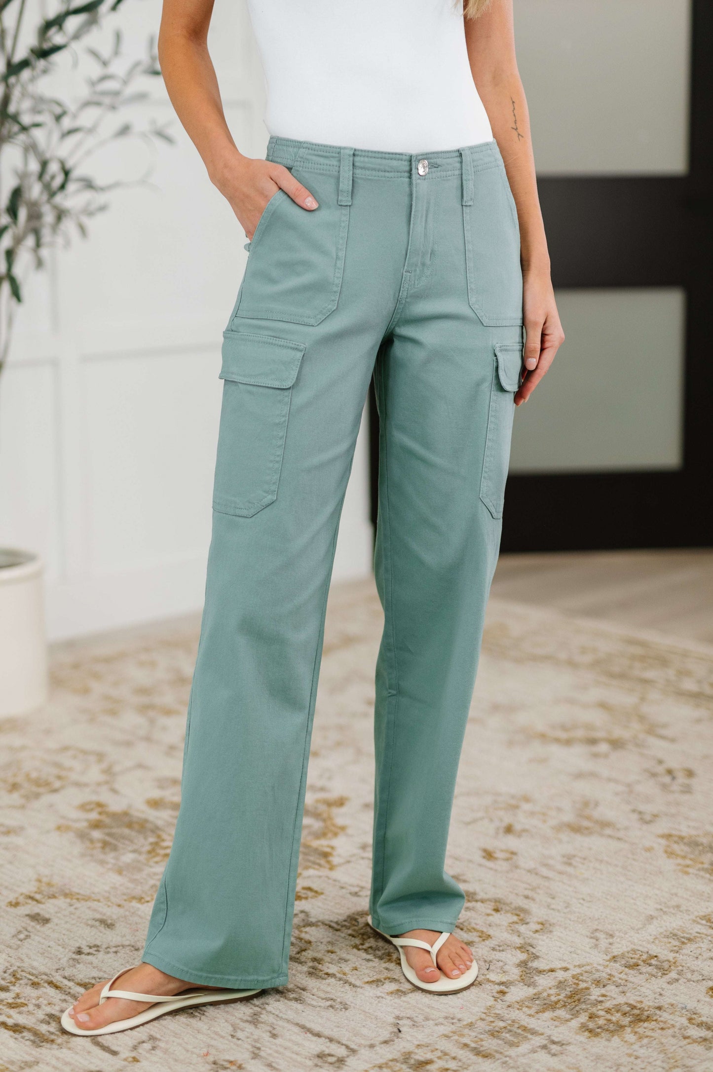 Woman wearing Pocket the Attitude Cargo Bottoms in twill with utility patch pockets and straight leg fit