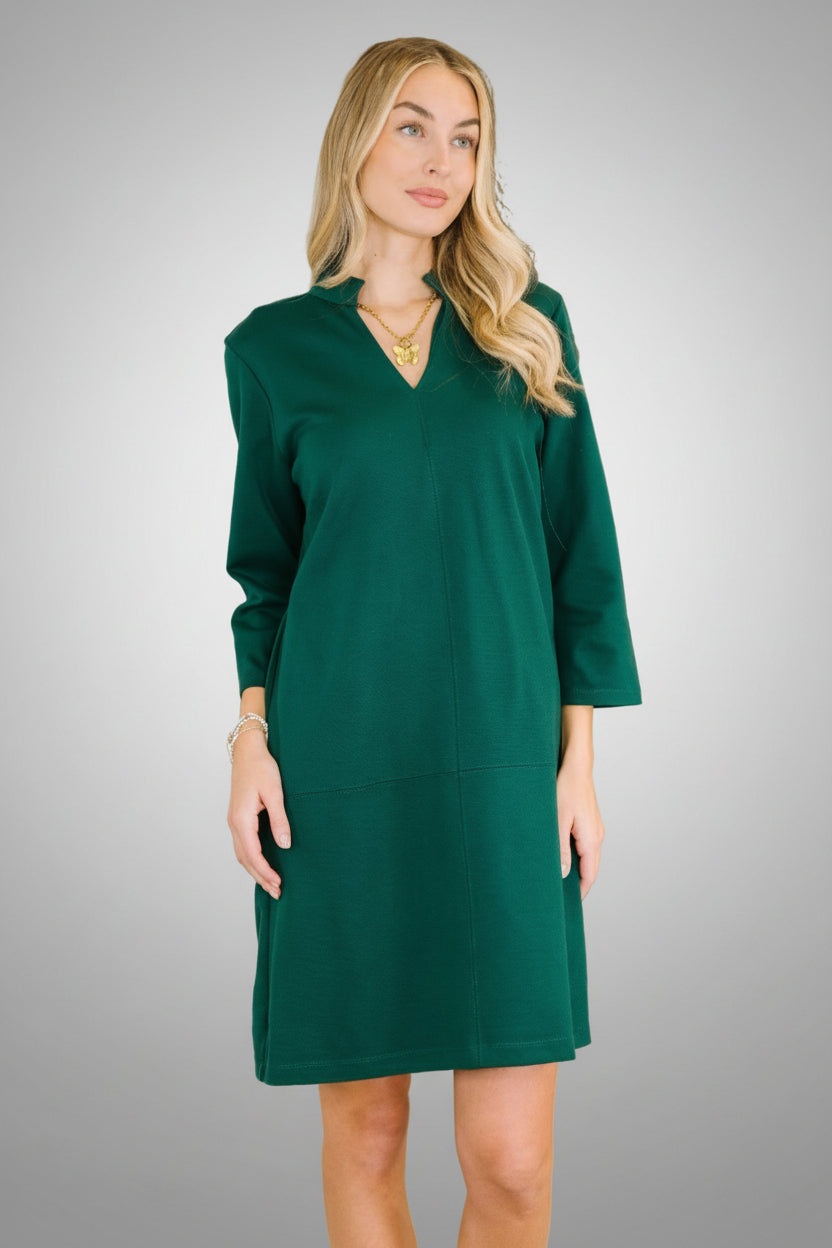 Hunter green ponte knit v-neck dress with three-quarter sleeves and side pockets.