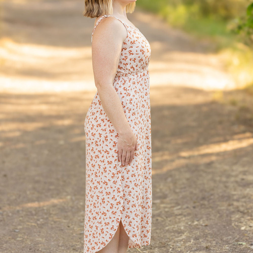 
                      
                        Reagan Ribbed Midi Dress - Sand and Rust Floral
                      
                    