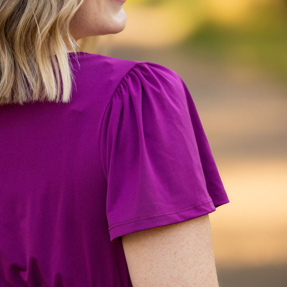 
                      
                        Emery Ruffle Top - Purple
                      
                    