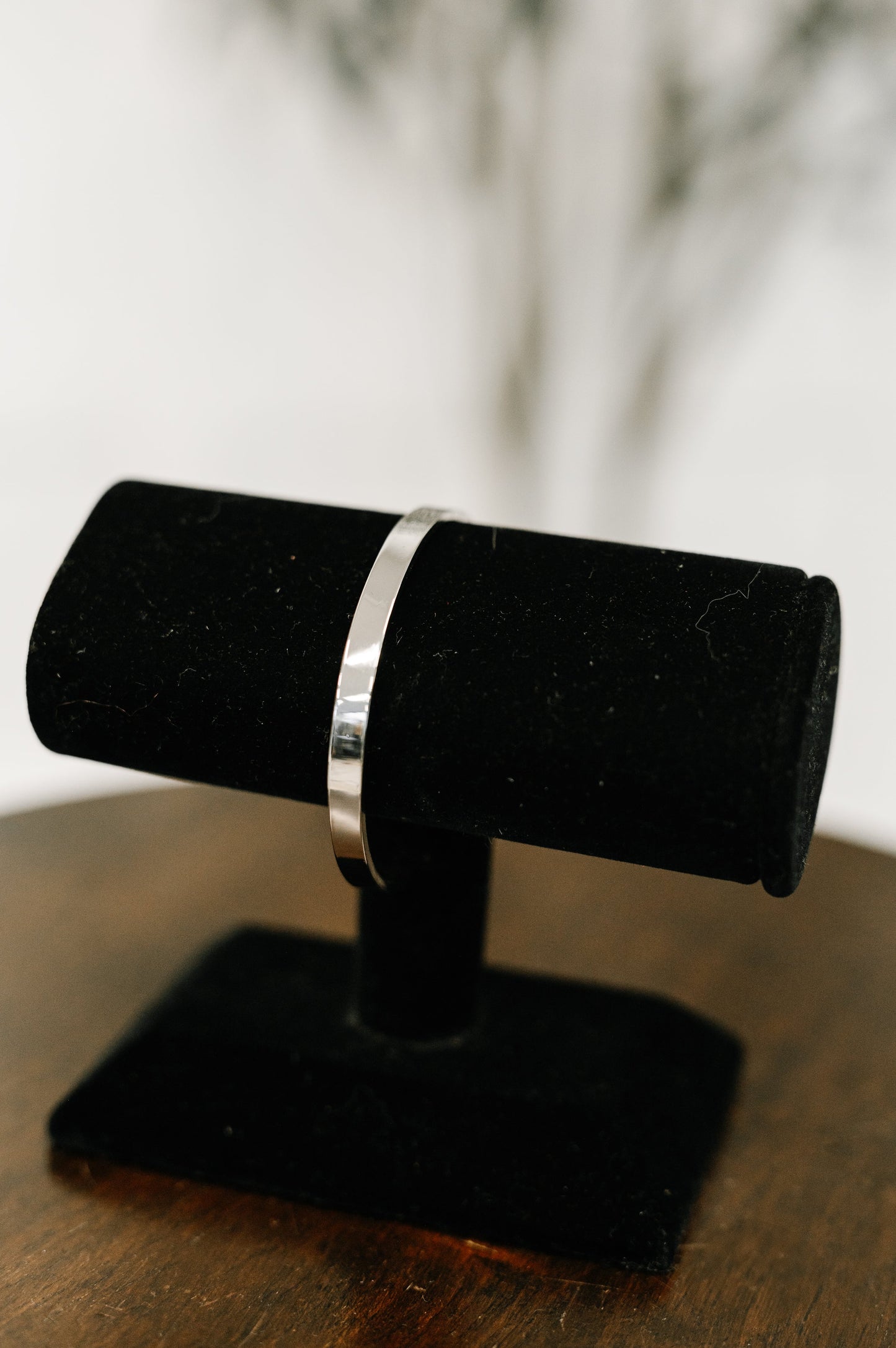 Polished silver adjustable bangle bracelet with classic minimalist design