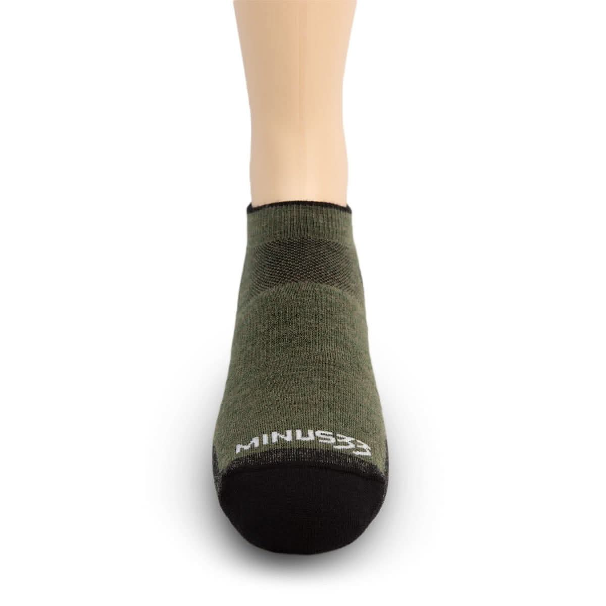 Green ankle sock on a white background with 'MINUS33' branding.